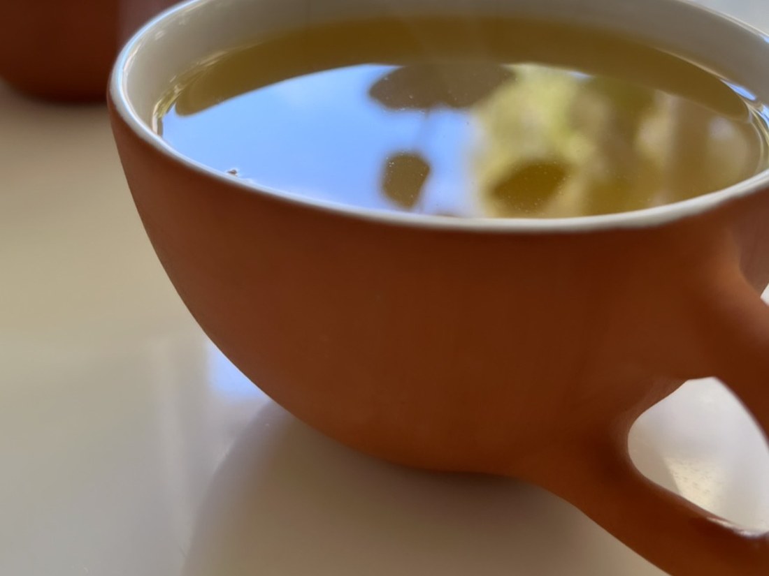 Two cups of herbal tea by the window