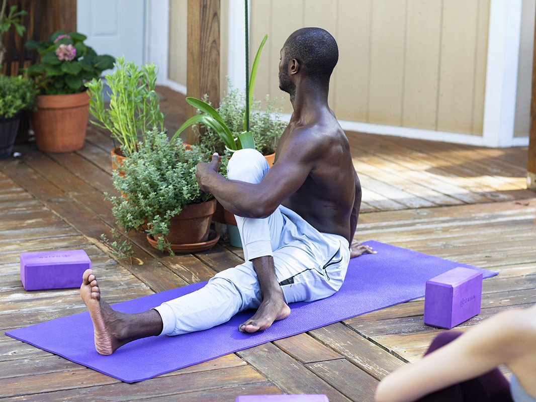 A seated spinal twist on the deck