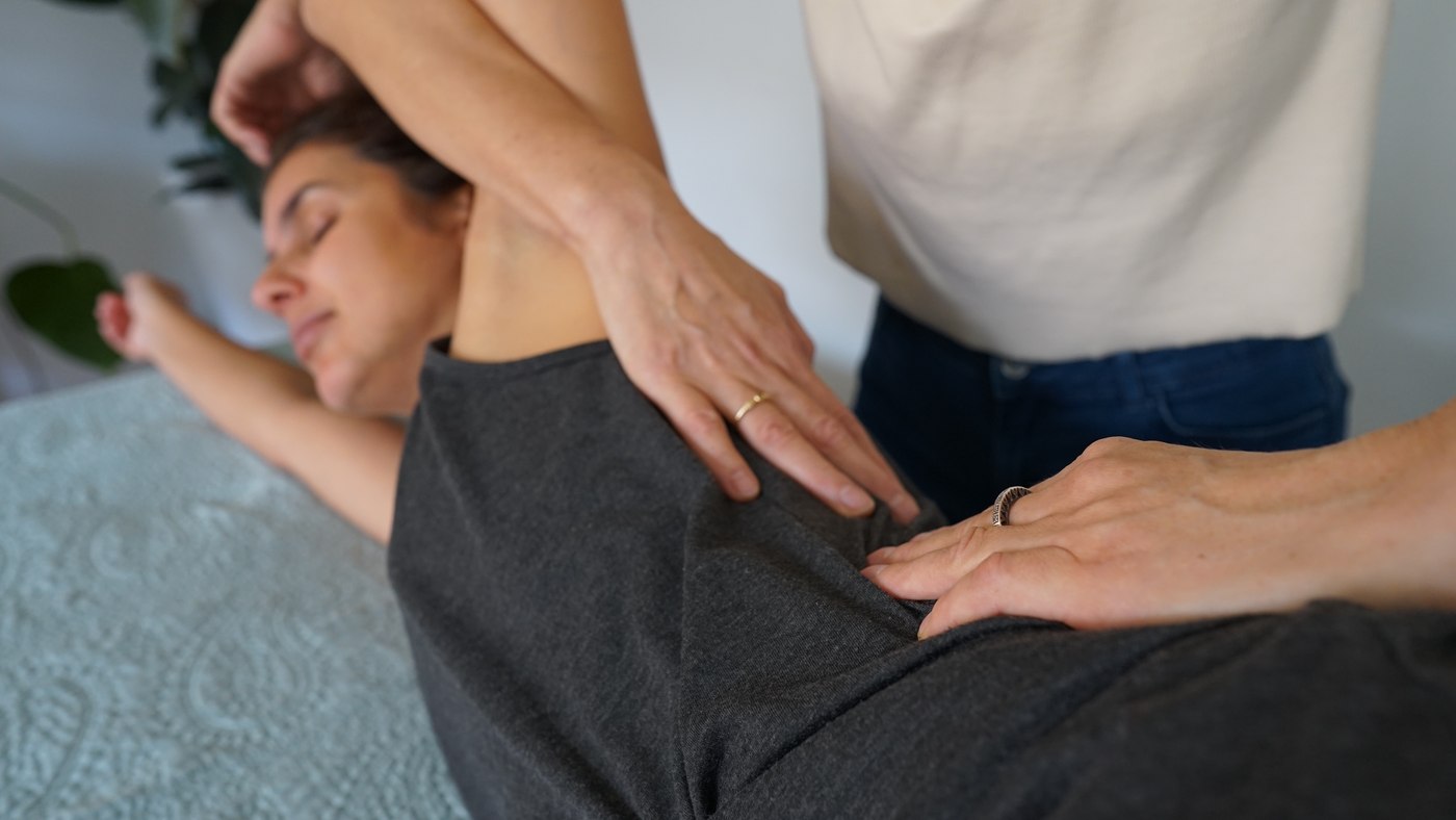 Hands-on support at the shoulder during a session